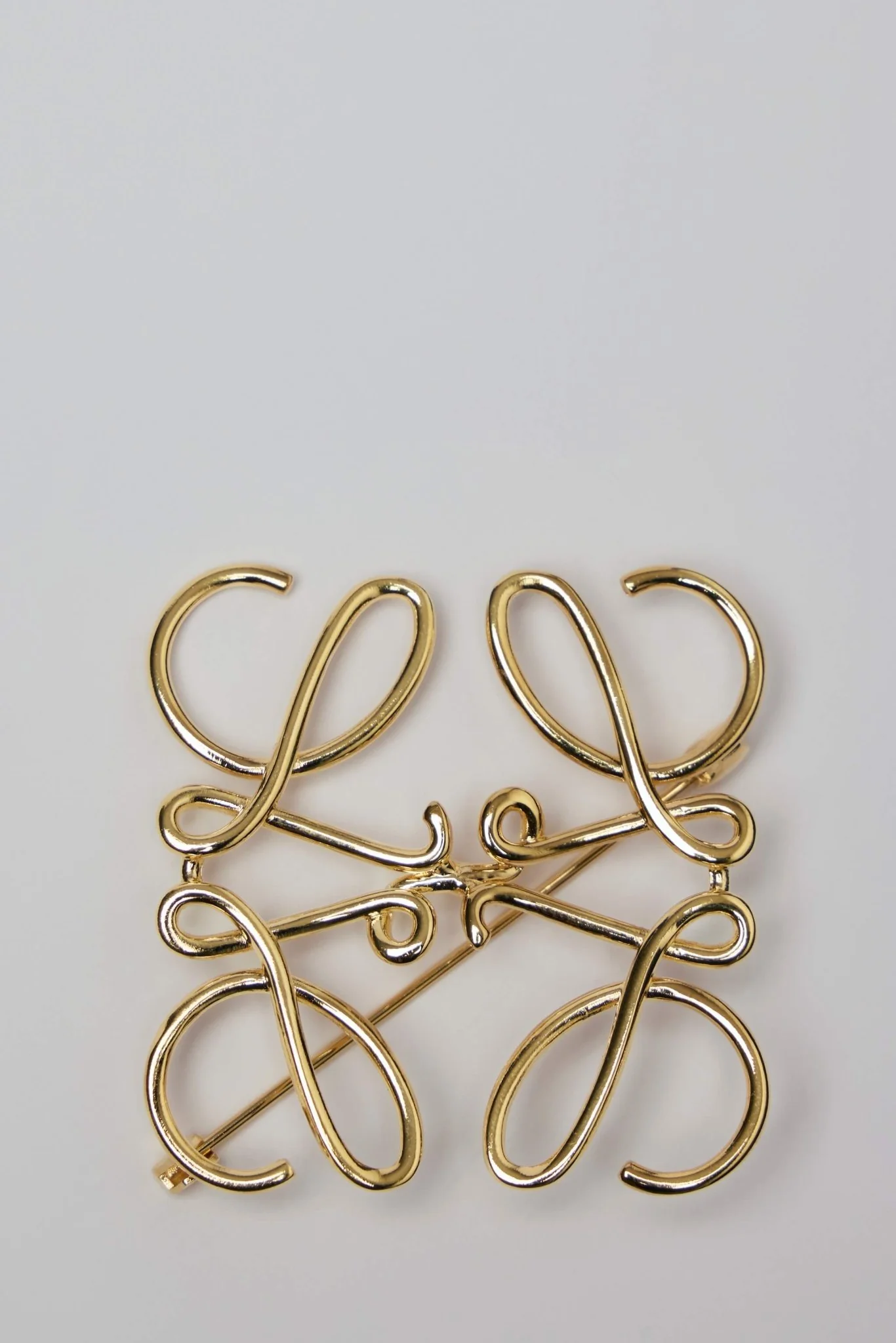 Anagram Brooch in Metal