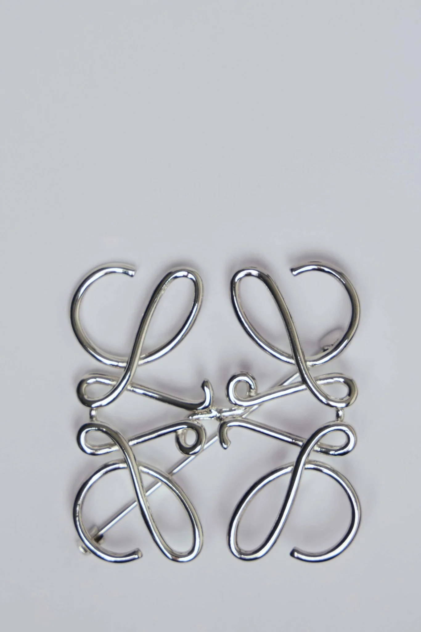 Anagram Brooch in Metal