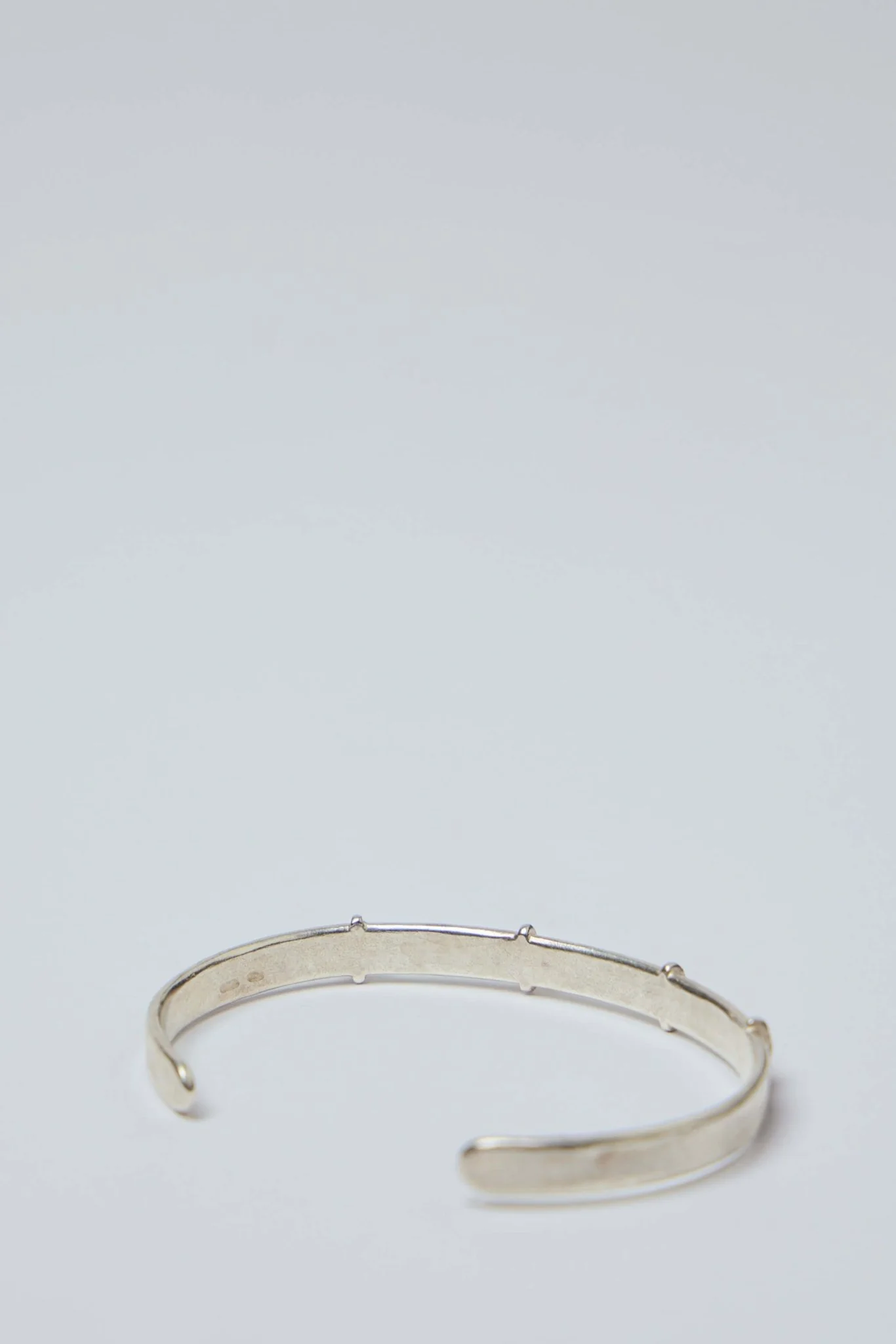 Thin Silver Stitched Cross Bangle - Image 3